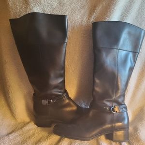 Knee-high, Equestrian riding boots with gun metal hardware & strap. 1.5" heel.